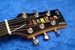 Jackson_JJ-2_Tobacco_Sunburst_(Headstock_2).jpg